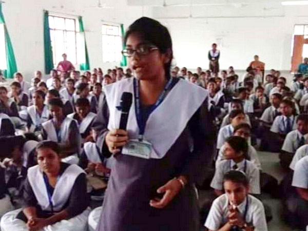 A schoolgirl questioning police official at awareness programme at Barabanki on July 31. Photo/ANI