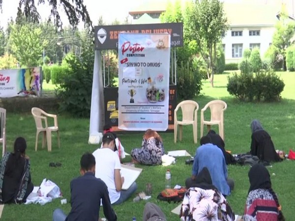 Students participating in the poster competition  in Kashmir University, Srinagar. (Photo/ANI)