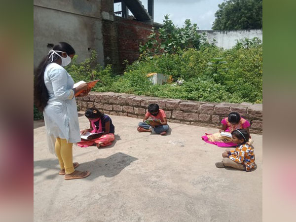 A Vidya Volunteer teaching students following COVID-19 norms in Hyderabad. (Photo/ANI)