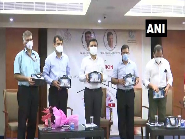 Goa Chief Minister Pramod Sawant (in the middle) launching 'home isolation kit' with Health Minister Vishwajit Rane (Right to Sawant) and other officials. (Photo/ANI)