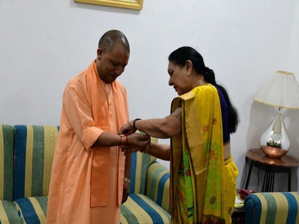Uttar Pradesh governor Anandiben Patel tied rakhi on the wrist of Chief Minister Yogi Adityanath while celebrating Raksha Bandhan on Thursday. Photo/ANI
