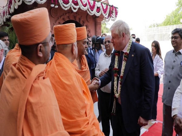Priests greeting British PM Boris Johnson in Akshardham temple in Gandhinagar