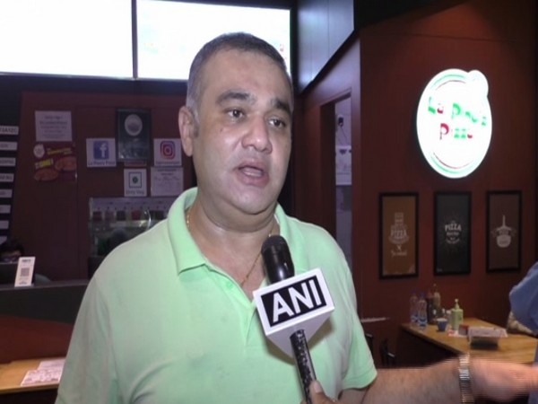 Divyesh, the owner of the restaurant speaking to ANI in Surat, Gujarat. [Photo/ANI]