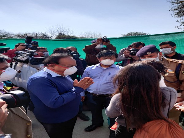 Union Health Minister Harsh Vardhan meets the first batch of people leaving the quarantine facility at Chhawla on Monday. 