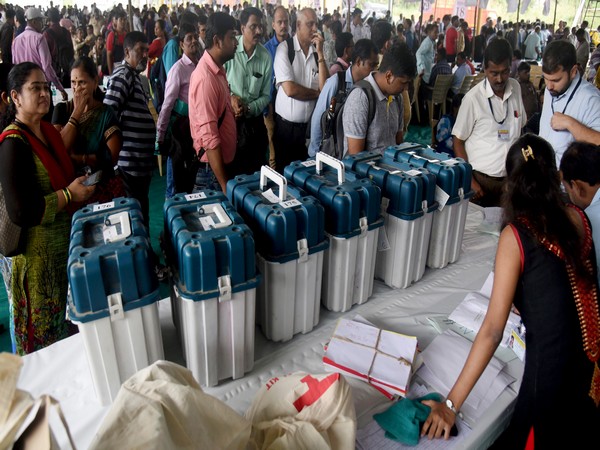 Polling staff getting the EVMs and other polling materials to take them to the polling stations on the eve of assembly elections at Jogeshwari in Mumbai on Sunday. (ANI Photo)