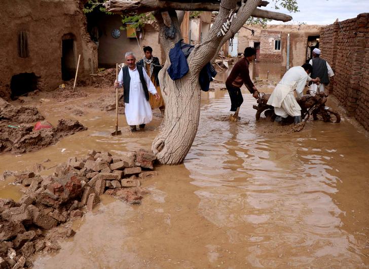 Locals trying to salvage their belongings from flood-affected homes in Herat, Afghanistan on March 30 (Image Source: Reuters)
