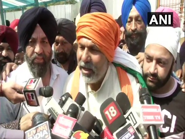 BKU leader Rakesh Tikait speaking with reporters on Sunday.