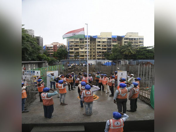 Migrant workers at Mumbai's Nahar Group celebrating India's 75th Independence Day supporting the cause of 'Freedom from Covid19'  