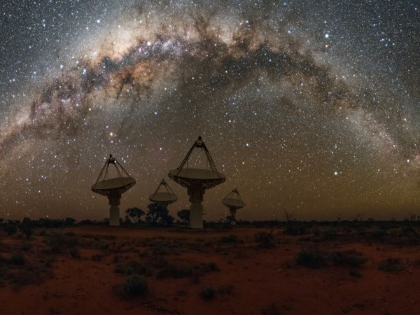 Antennas of CSIRO's ASKAP telescope under the Milky Way in Western Australia. (Image credit: CSIRO/Alex Cherney)