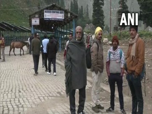 Pilgrims wait for it to recommence Amarnath yatra. (Photo/ANI)