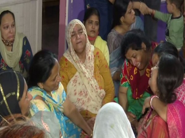 Visual of family mourning on demise of school teachers in Srinagar (Photo/ANI)