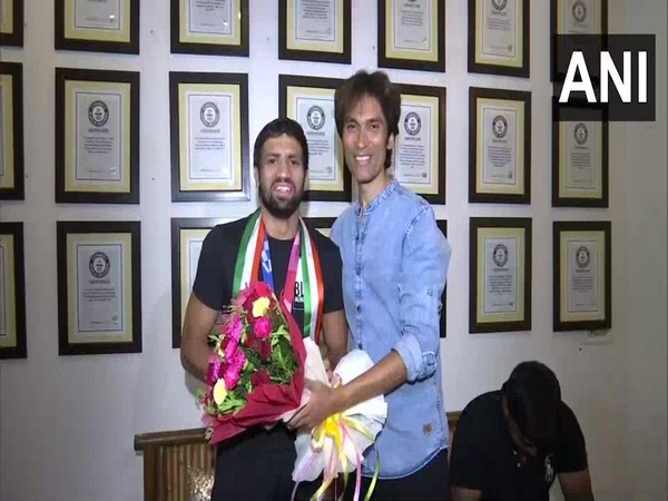 Wrestler Ravi Dahiya with his motivator Vickrant Mahajan (Photo/ANI)