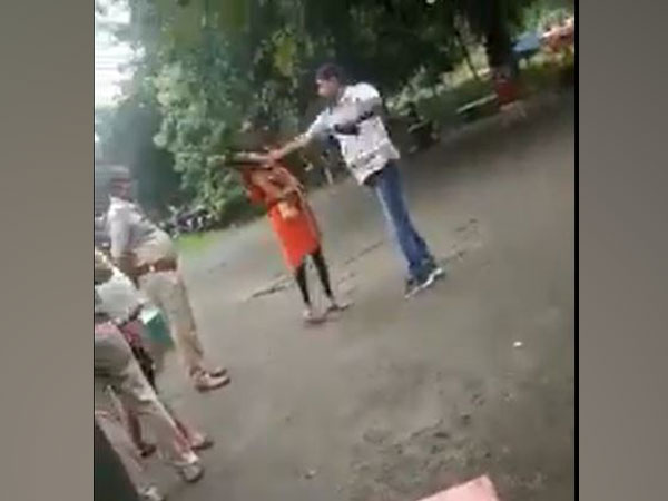 Viral video of a cop from Sahibganj district's Barhait police station slapping a young woman. (Photo/ANI)