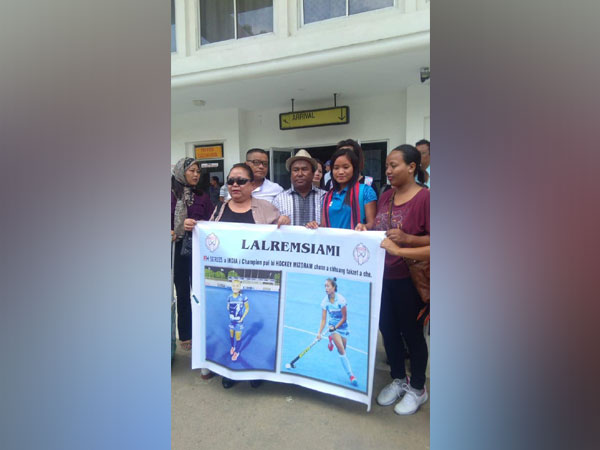 Indian women's hockey team forward Lalremsiami received by the villagers. 