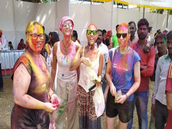 Foreign tourists celebrate Holi with locals