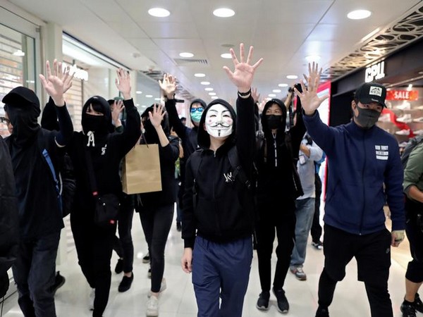 Masked demonstrators at shopping mall in Hong Kong. 