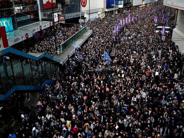 Tens of thousands marched in the streets of Hong Kong on eve of anti-government movement