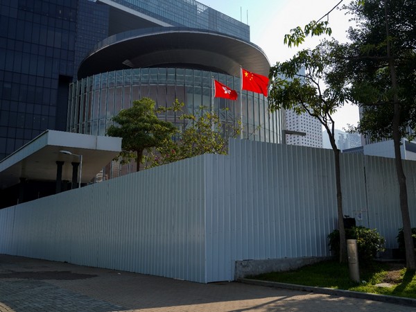 Chinese and Hong Kong flags are hung at the Legislative Council. (Photo credit: Reuters)