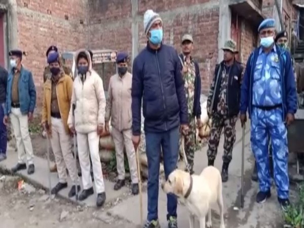 Police personnel investigating the case in Chhoti pahari. (ANI/photo)