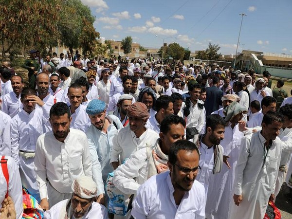 Detainees wait for their release by the Houthis at the central prison of Sanaa, Yemen on Monday