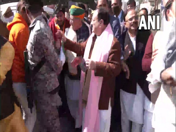 BJP national president JP Nadda conducts door-to-door campaign in Shikohabad. (Photo/ANI)