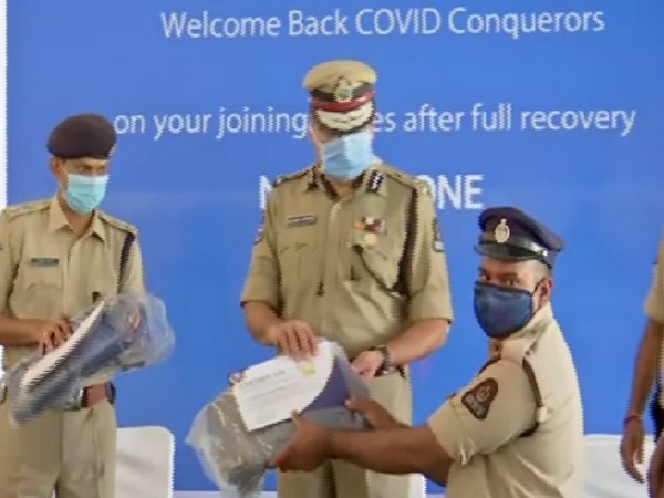 Anjani Kumar, Commissioner of Police, Hyderabad City with police personnel joining back duty on Thursday. 