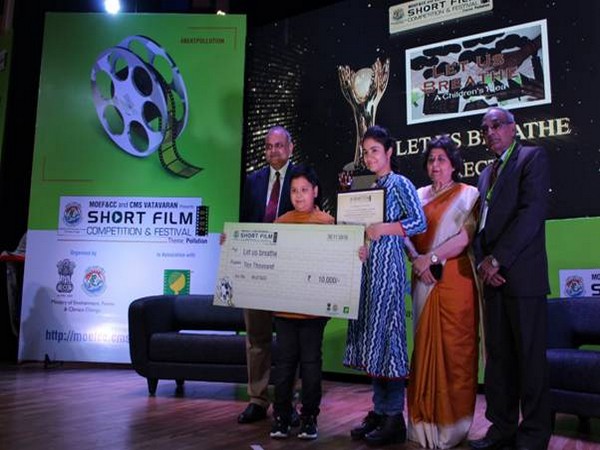 School student receiving the award for his film at 2019 CMS VATAVARAN film festival