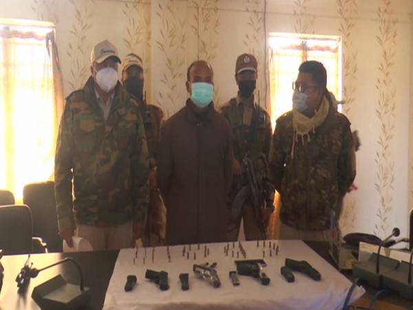 Imphal police with arrested Mayengbam Amarjit Singh on Sunday. (ANI/pictures)