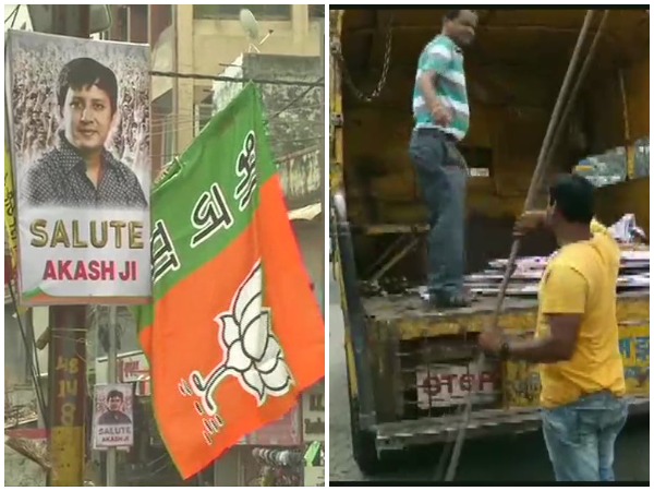 Indore Municipality workers while removing the posters put up in favour of BJP MLA Akash  Vijayvargiya on Friday. (Photo: ANI)