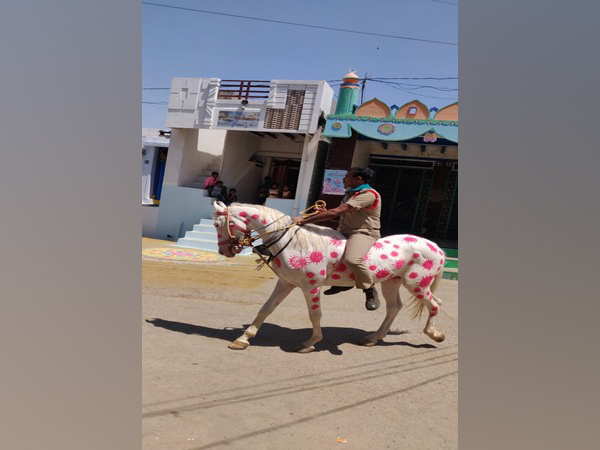 A poliman riding a horse in Kurnool with COVID-19 design. [Photo/ANI]