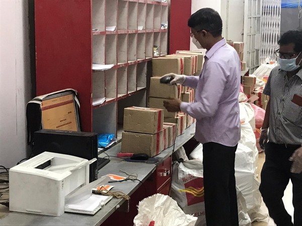 An official of the India Post working. 