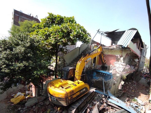 A visual of the demolition of illegal house in Indore. 