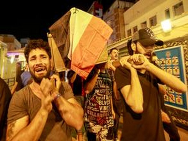 Mourners carry the coffin of a protester, who was killed in Tuesday's demonstrations in Baghdad, during a funeral in Najaf.