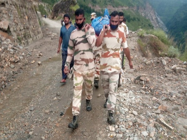 A visual of ITBP jawans carrying the body in Uttarakhand. 