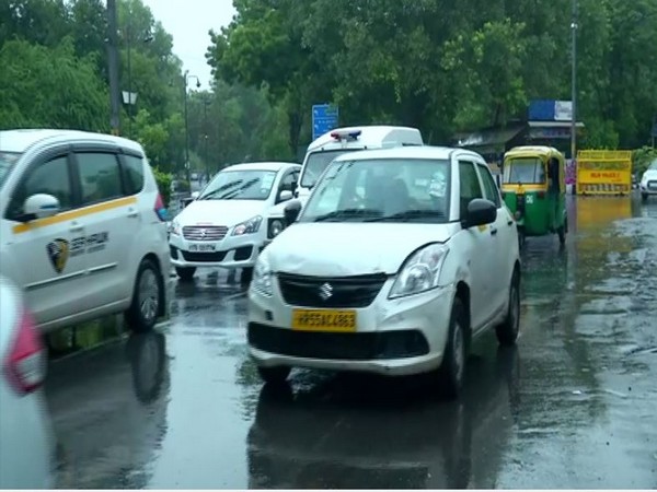Traffic jam at RK Puram due to rain. Photo/ANI]