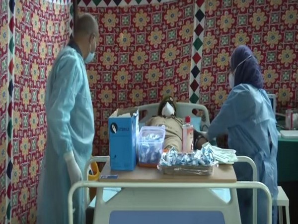 Policeman getting tested at Plasma Screening Camp at Kashmir Nursing Home. [Photo/ANI]