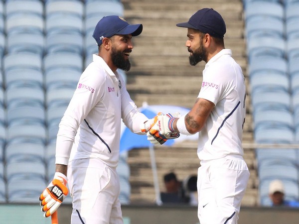 Ravindra Jadeja (L) and Virat Kohli (R) during their partnership on day two of Test in Pune on Friday. (Photo/BCCI Twitter)