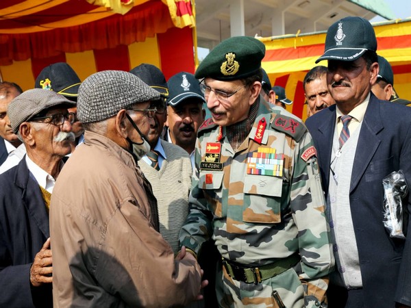 Northern Army Commander Lieutenant General Y K Joshi interacting with veteran soldiers.