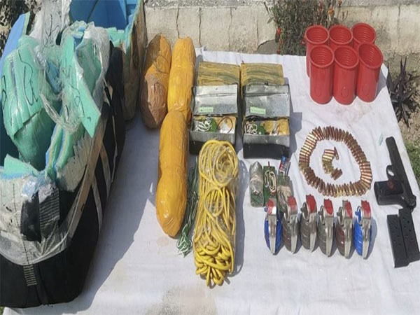 Recovered arms and explosives with Jammu Police. (ANI/Twitter)