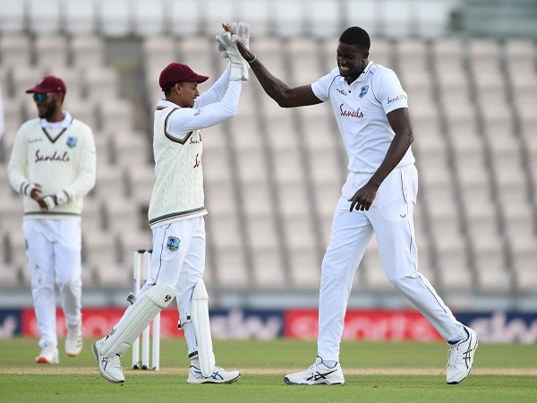 West Indies' Jason Holder celebrates the wicket of England's Ben Stokes with teammates