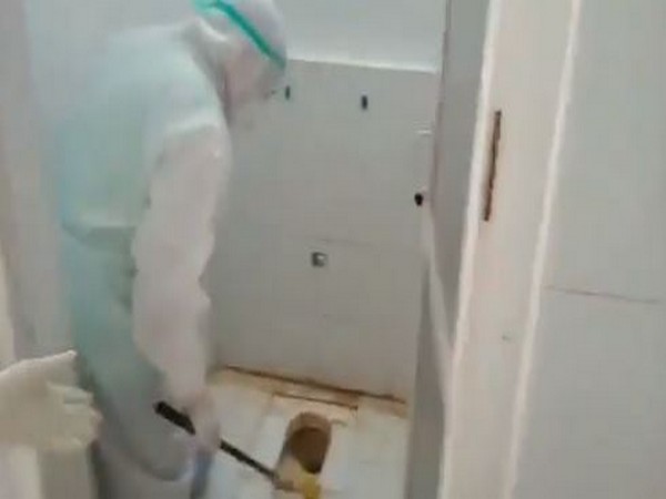 Puducherry Health Minister cleaning a toilet at a COVID ward.