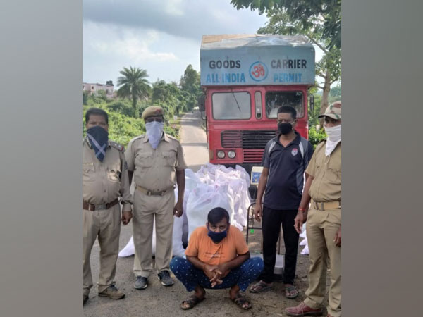 Odisha Police officials with the arrested truck driver. (Photo/ANI) 