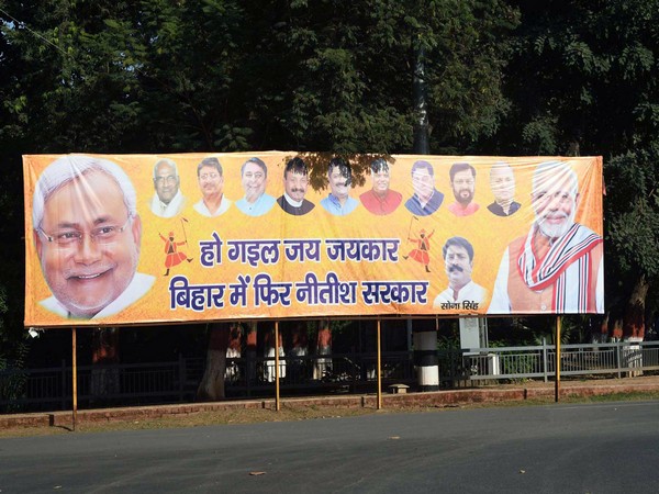 NDA's supporters put up a hoarding in Patna after the declaration of the Bihar Assembly elections results. (ANI Photo)