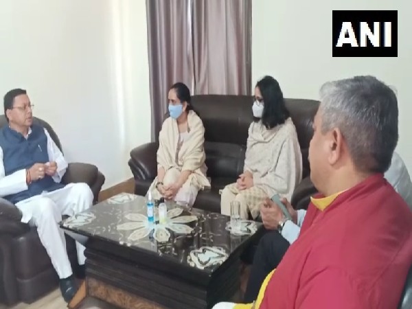 Uttarakhand Chief Minister Pushkar Singh Dhami met daughters of late Chief of Defence Staff General Bipin Rawat and Madhulika Rawat - Kritika and Tarini (Photo/ANI)
