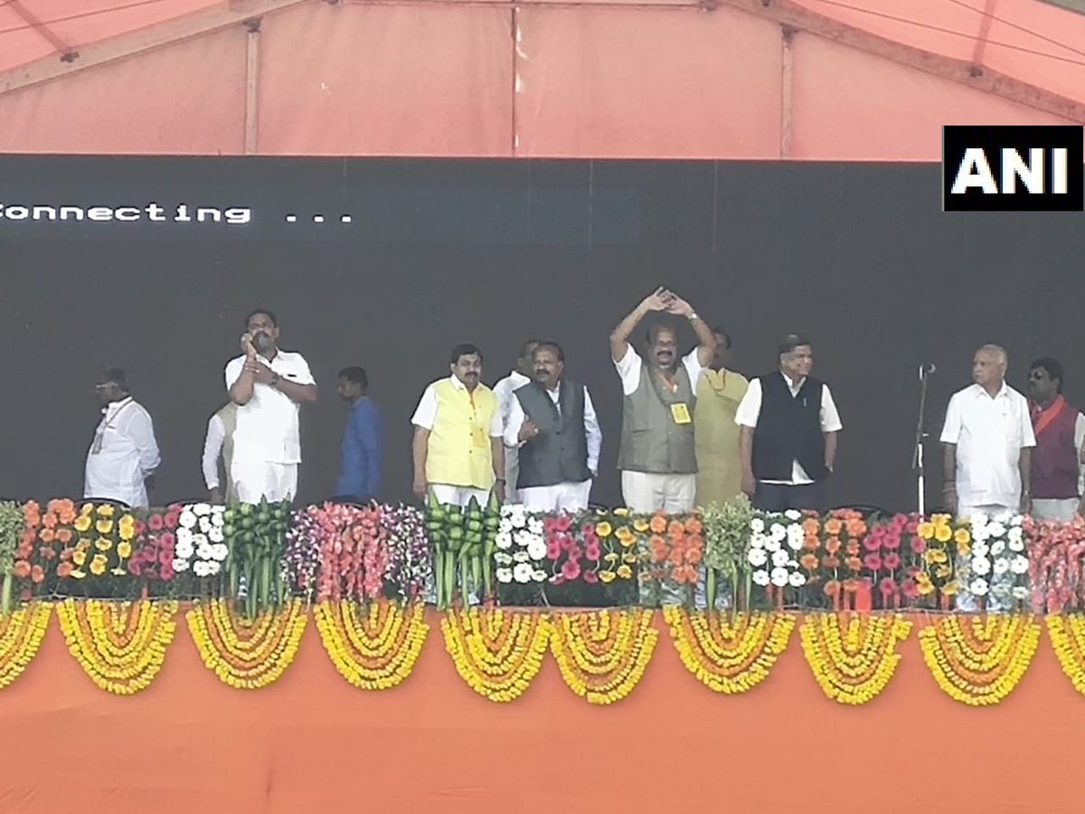 Dr Umesh Jadhav (in the centre wearing a yellow badge) at the venue of Prime Minister Narendra Modi' event at Kalaburagi on Wednesday. Photo/ANI