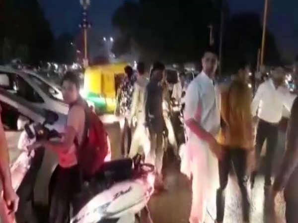 Madhya Pradesh Sports Minister, Jitu Patwari (white kurta) while managing traffic in Indore on Tuesday.