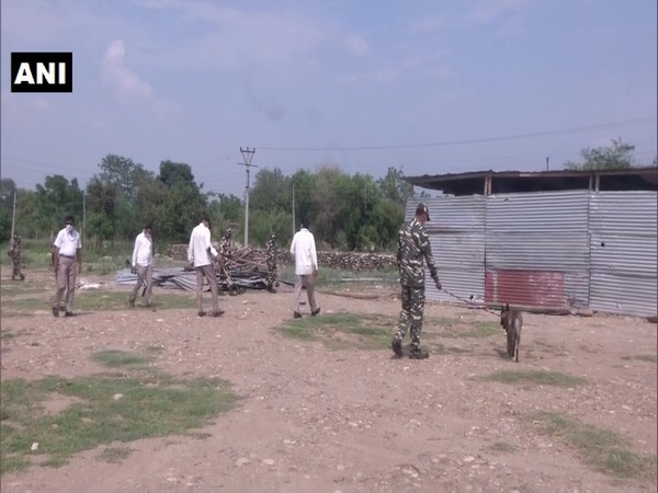 CRPF using metal detectors to search the ares 