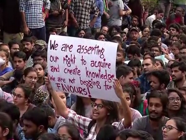 Students raised banners during the protest on Monday (Photo/ANI)