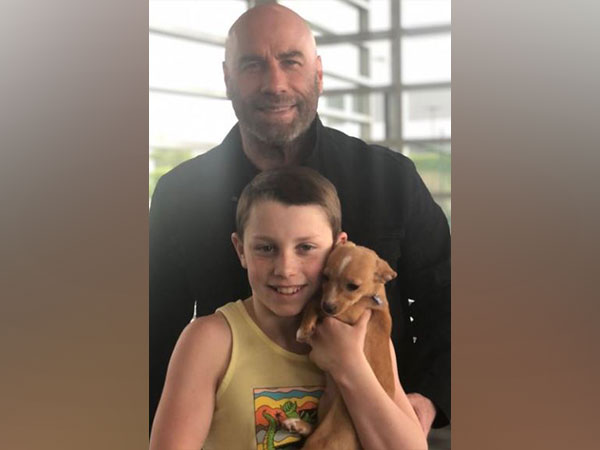 John Travolta and his son with the rescued dog (Image source: Instagram)