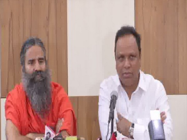 Yoga Guru Ramdev and Maharashtra Education Minister Ashish Shelar speaking at a press conference in Mumbai on Wednesday. Photo/ANI